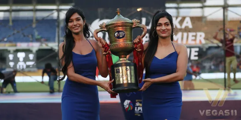 Lanka Premier League 2025 trophy presentation ceremony with two hosts holding the cup
