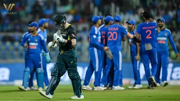 Indian cricket team players celebrate a wicket while an Australian batter walks off during the 2nd T20I in Thiruvananthapuram, November 26, 2023.