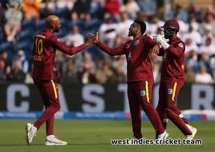 West Indies players and captain Roston Chase(L)